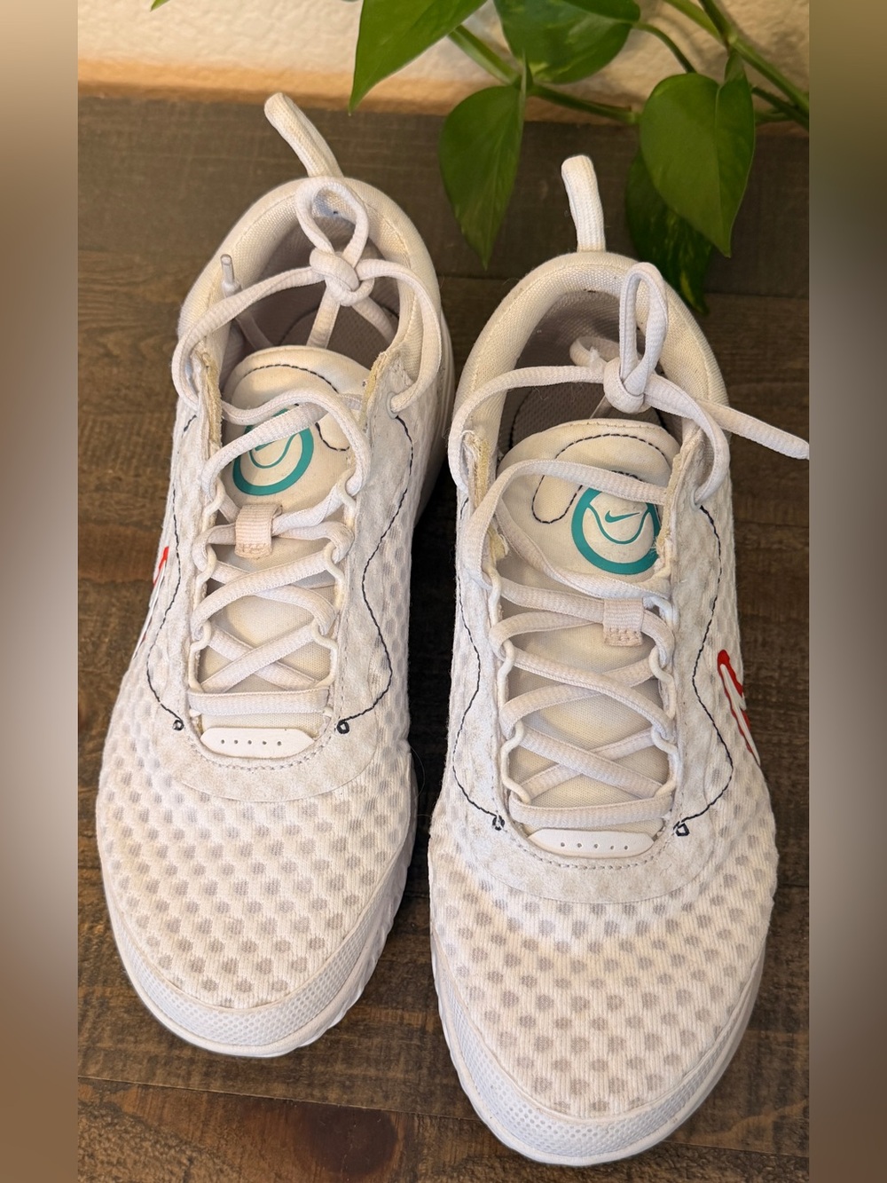 Nike Women's White Sneakers with Teal Logo and Red Swoosh